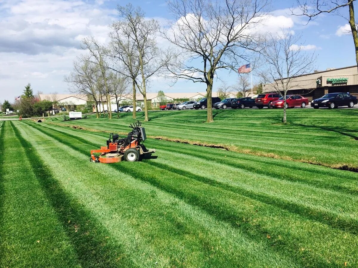 Fresh mowing stripes across a manufacturing campus